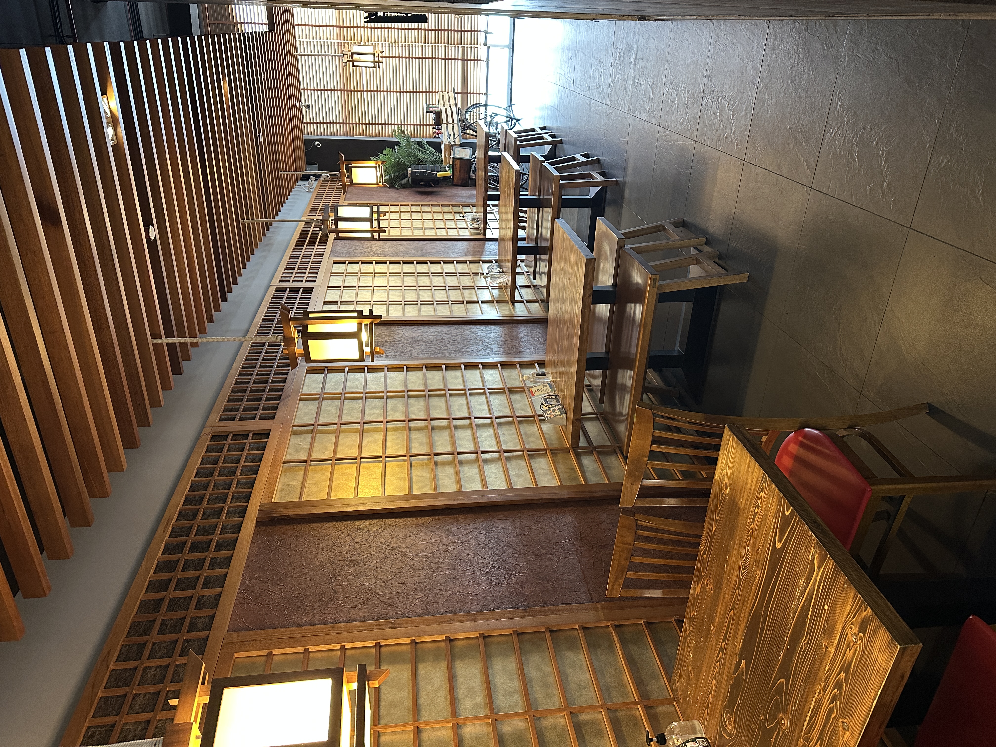 RAYU interior with shoji screens, lanterns and wooden tables